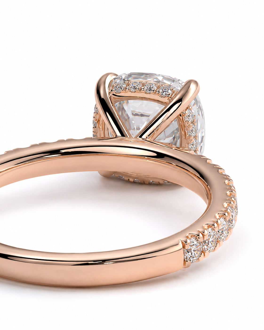 color_10K_RG, color_14K_RG &&Rose gold engagement ring with a large oval-cut clear center stone and pave-set accent stones along the band, shown on a clean white background.