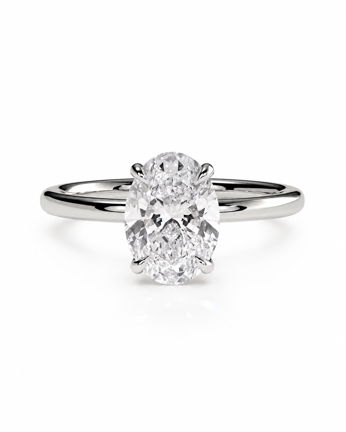 color_925_SIL,color_935_ARG,color_10K_WG, color_14K_WG &&An oval-cut diamond solitaire ring set in a polished silver-colored metal band, shown against a plain white background.
