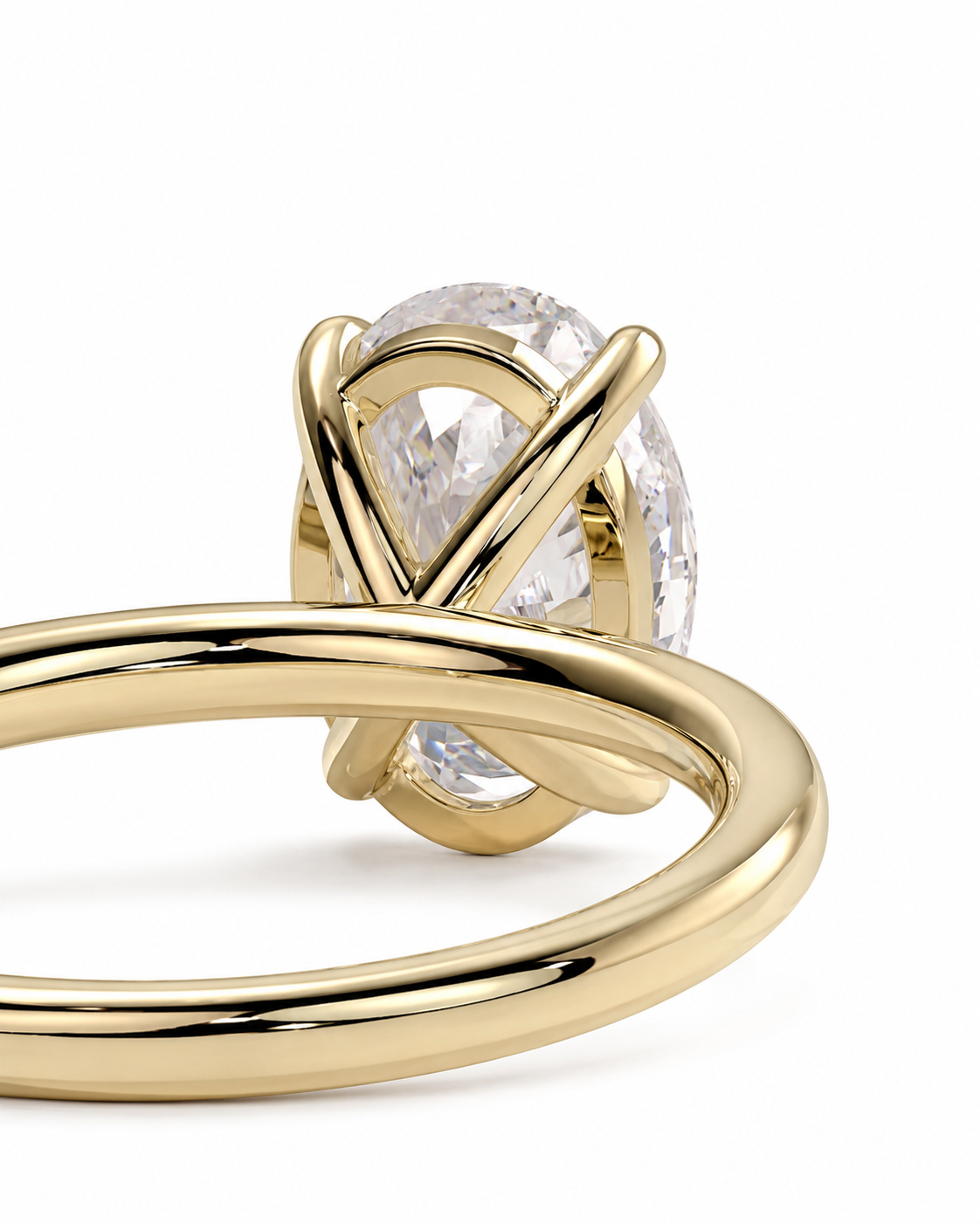 color_10K_YG, color_14K_YG &&A close-up of a gold ring featuring an oval clear gemstone in a wrap-style setting, shown against a plain white background.