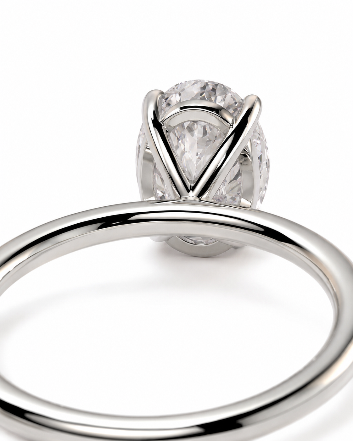 color_925_SIL,color_935_ARG,color_10K_WG, color_14K_WG &&A close-up studio shot of a silver-toned ring with a large clear gemstone in a prong setting, shown against a plain white background.