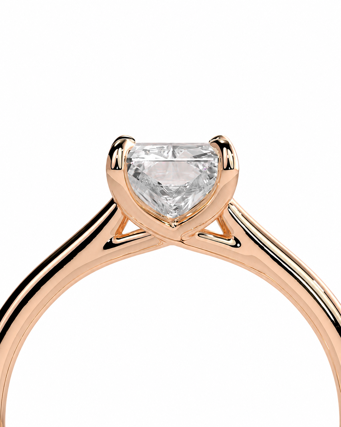 color_10K_RG, color_14K_RG &&A close-up of a rose gold ring featuring a heart-shaped clear gemstone in a four-prong setting, shown against a solid white background.