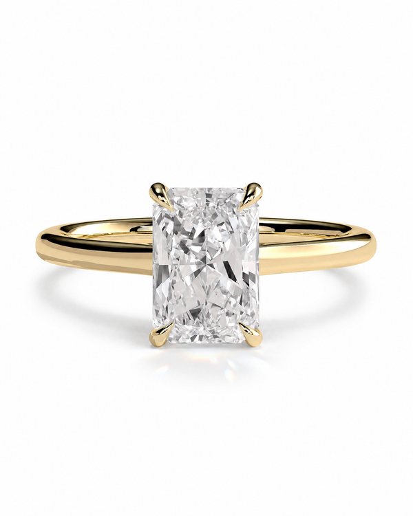 color_10K_YG, color_14K_YG &&An engagement ring featuring a rectangular radiant-cut diamond set in a yellow gold four-prong band, shown on a clean white background.