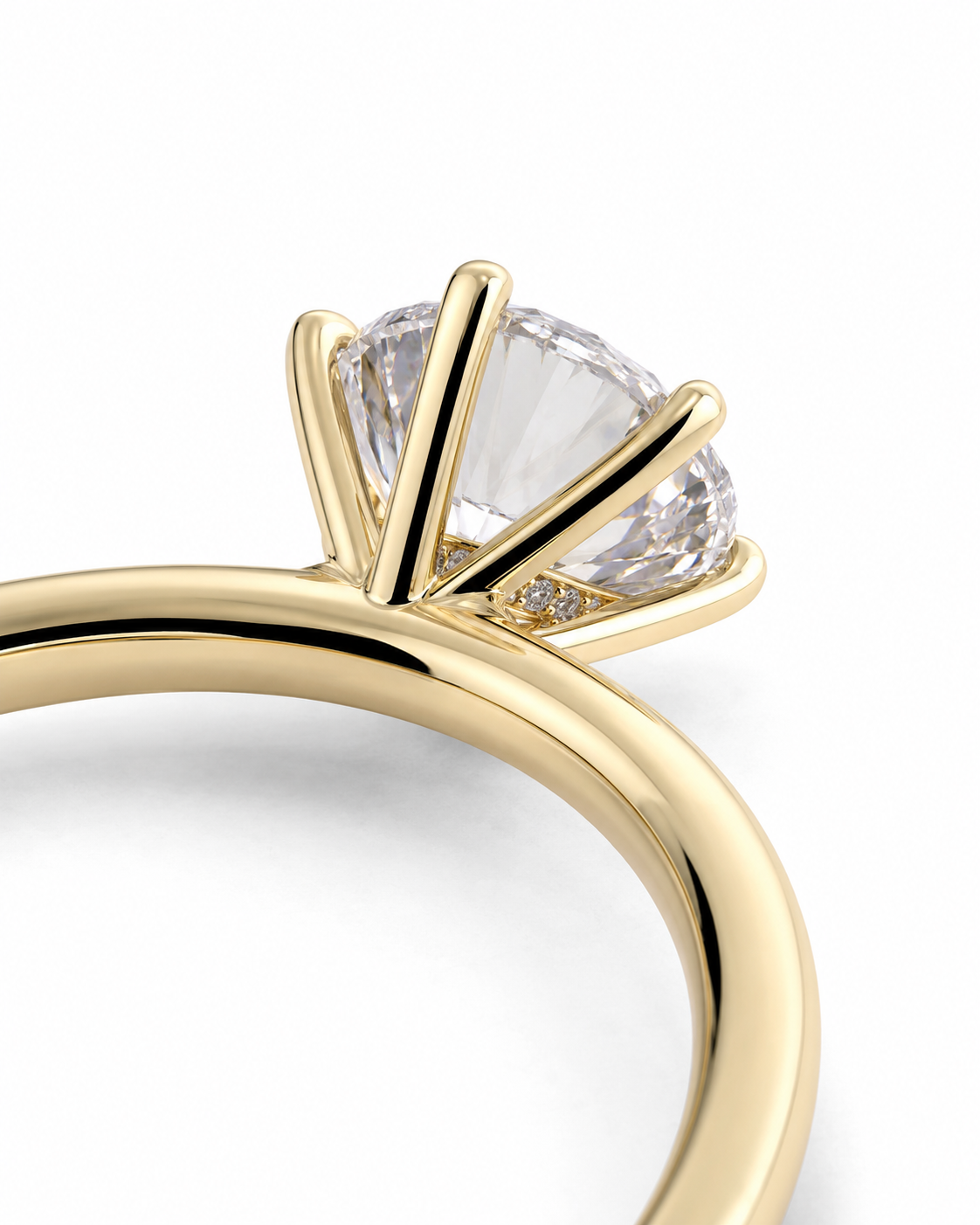 color_10K_YG, color_14K_YG &&A close-up of a yellow gold ring with a large clear round-cut gemstone in a prong setting, shown on a clean white background.