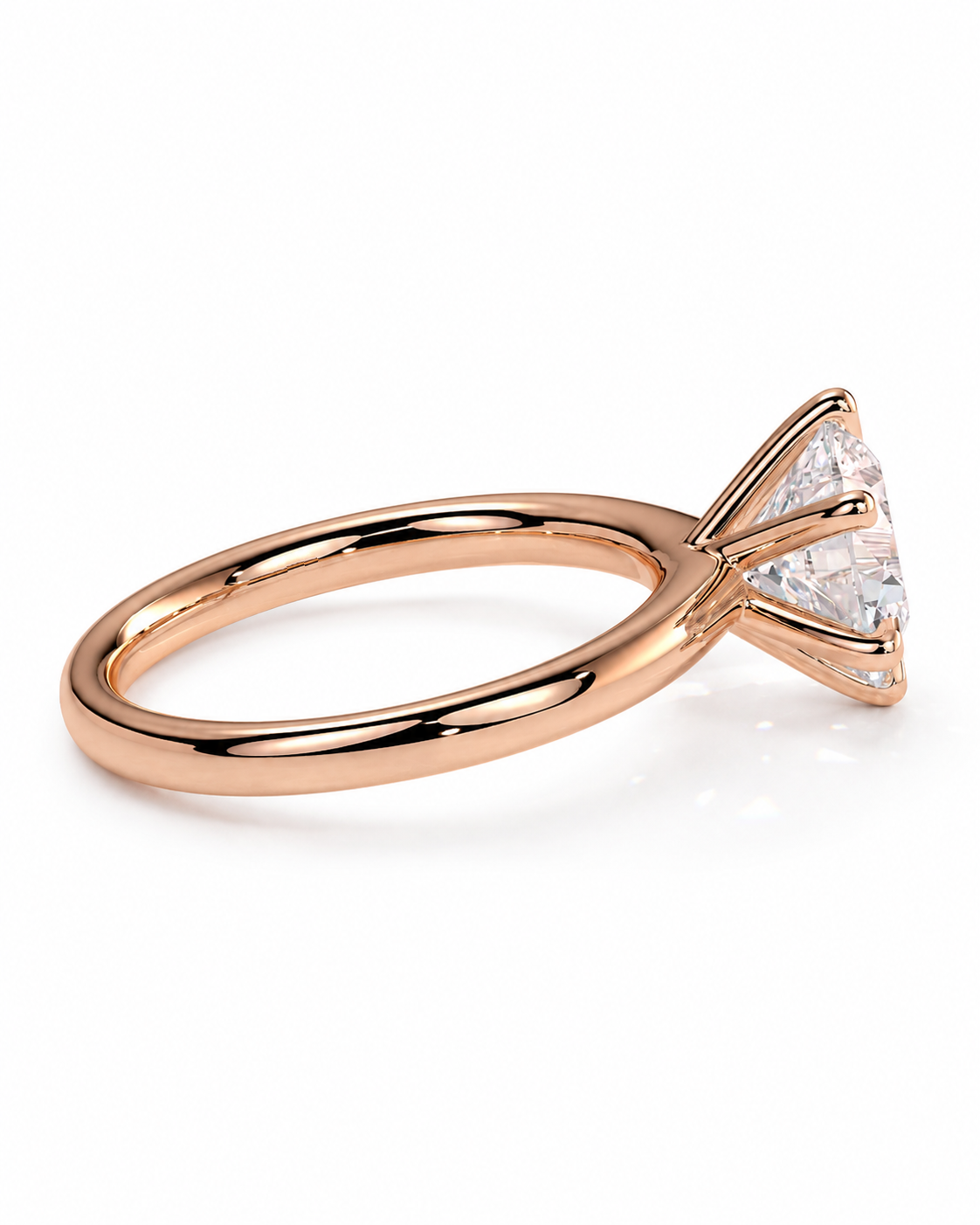 color_10K_RG, color_14K_RG &&A rose gold solitaire ring featuring a triangular bezel setting with a clear round-cut gemstone, shown on a clean white background.