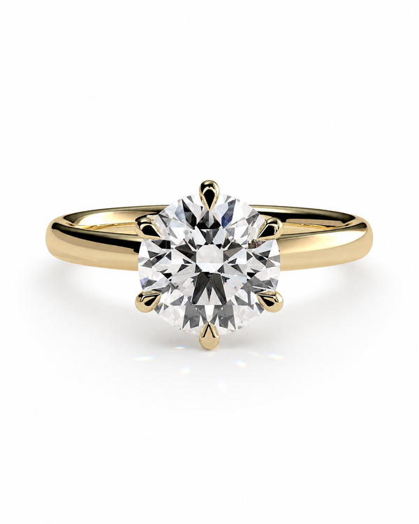 color_10K_YG, color_14K_YG &&A classic solitaire engagement ring featuring a round brilliant-cut diamond set in a yellow gold four-prong band, shown on a clean white background.