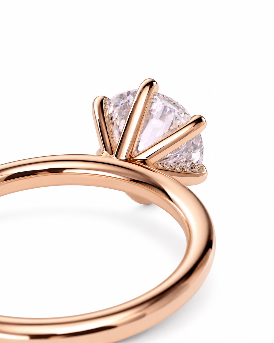 color_10K_RG, color_14K_RG &&Rose gold ring with a cushion-cut clear gemstone in a prong setting, shown on a clean white background.