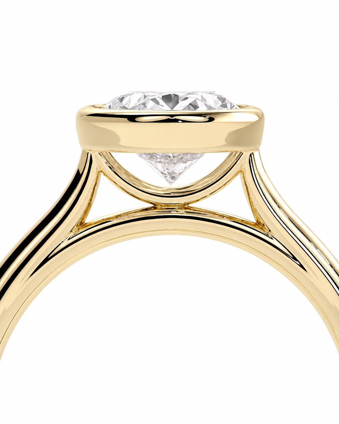 color_10K_YG, color_14K_YG &&Close-up of a yellow gold solitaire engagement ring with a round brilliant-cut diamond in a high-profile bezel setting, on a solid white background.