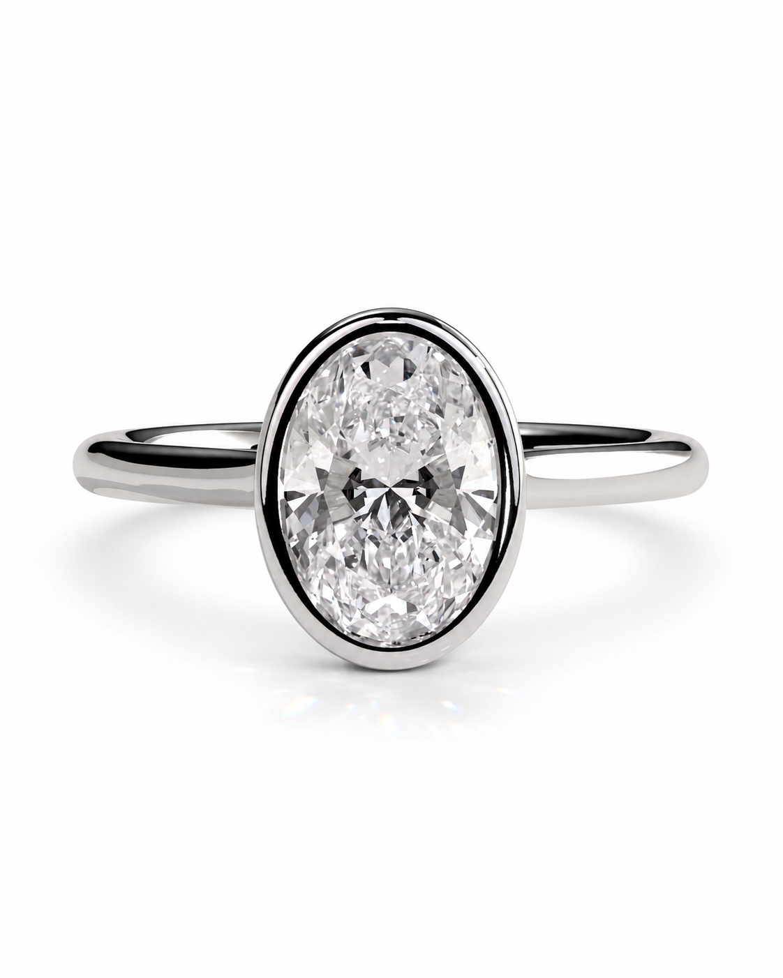 color_925_SIL,color_935_ARG,color_10K_WG, color_14K_WG &&An oval-cut diamond engagement ring with a polished silver-colored band, shown on a clean white background.