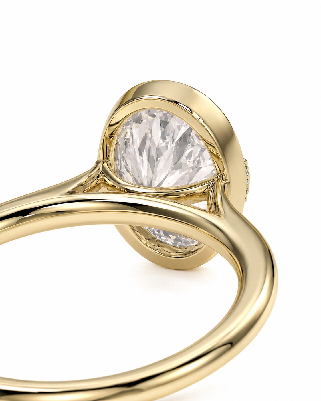 color_10K_YG, color_14K_YG &&Close-up of a yellow gold ring featuring a large oval-cut clear gemstone in a prong setting, with a smaller round gemstone on the band, shown against a white background.