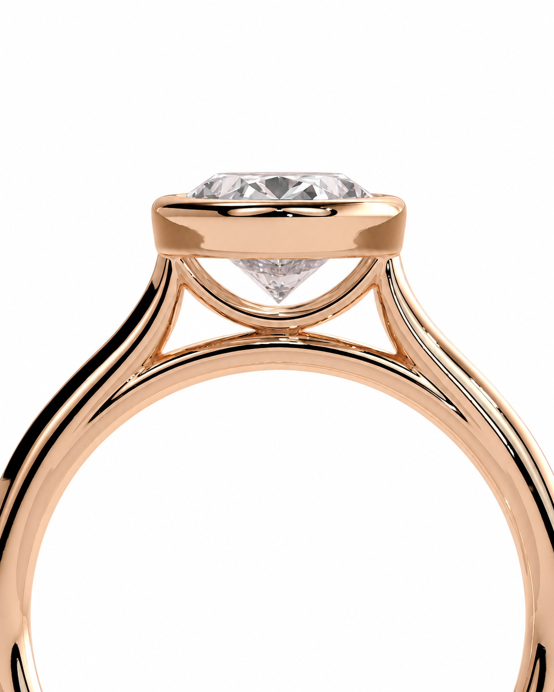 color_10K_RG, color_14K_RG &&A close-up of a rose gold solitaire engagement ring with a clear round-cut diamond, set against a solid white background.