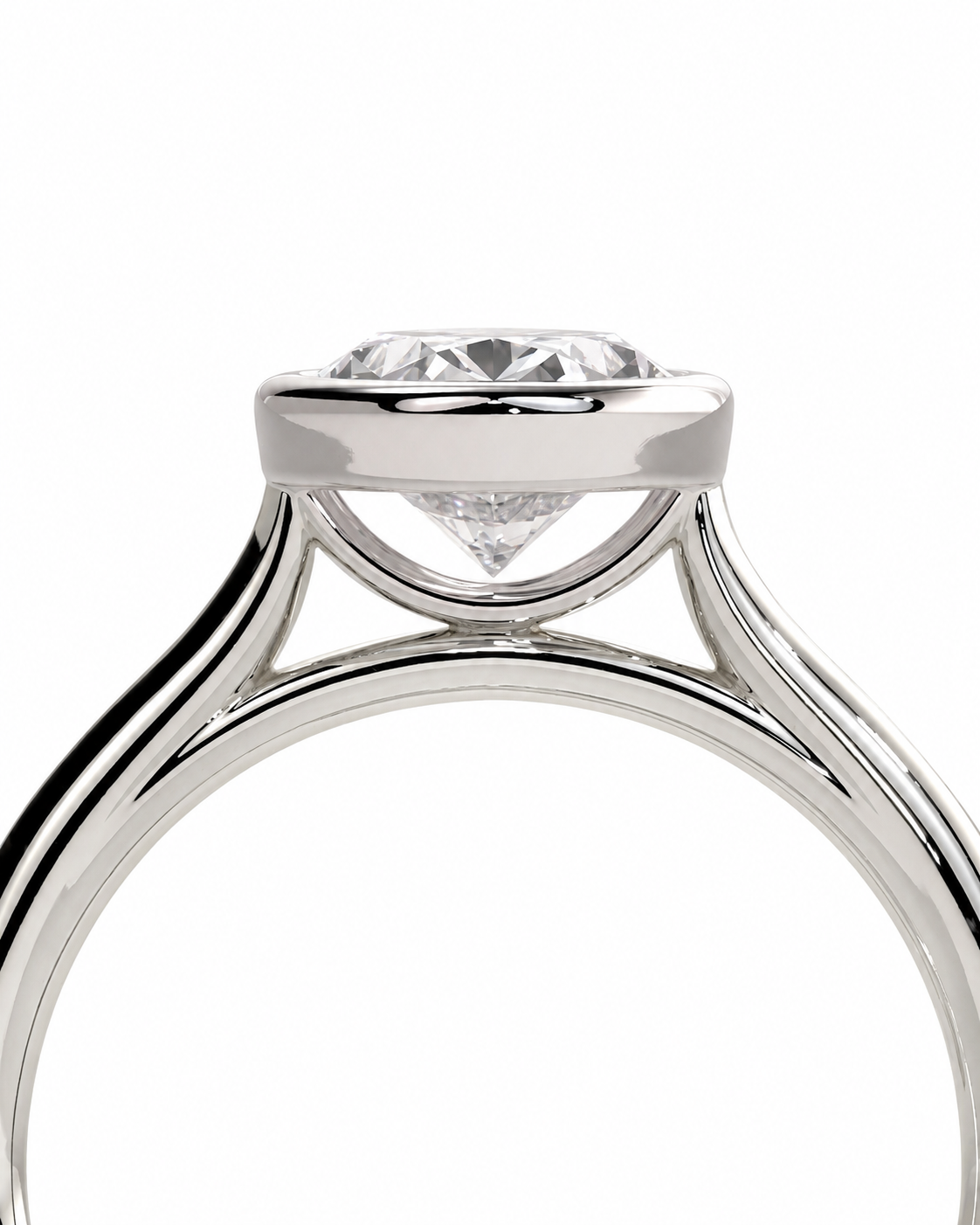 color_925_SIL,color_935_ARG,color_10K_WG, color_14K_WG &&A close-up studio shot of a silver-toned solitaire engagement ring with a round brilliant-cut diamond set in a three-prong halo, shown against a plain white background.