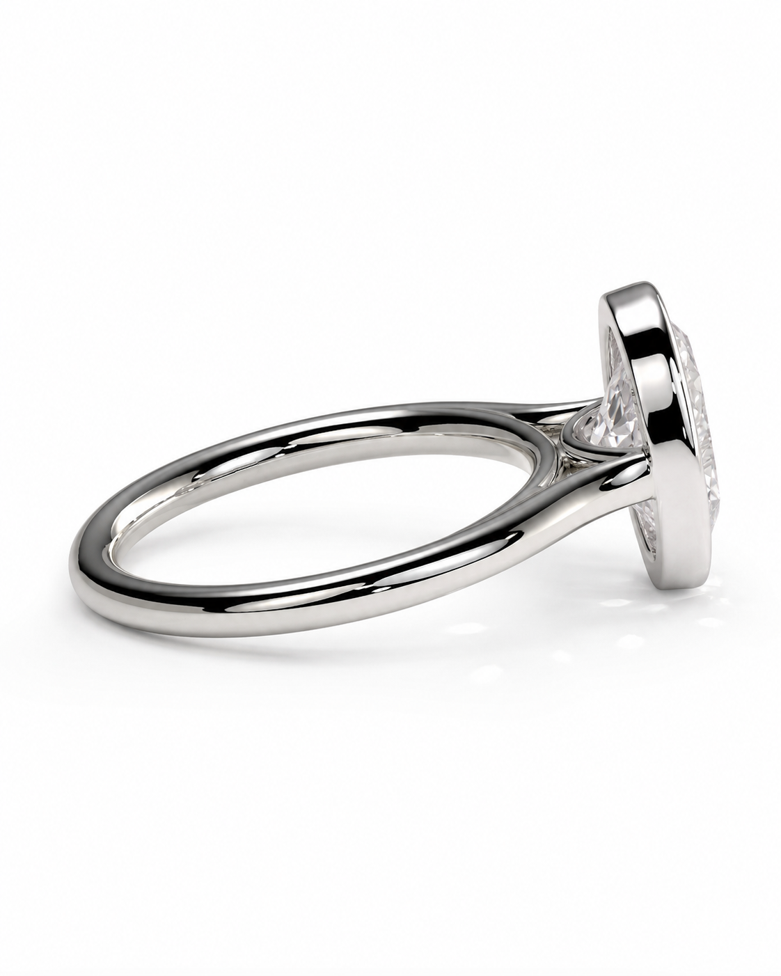 color_925_SIL,color_935_ARG,color_10K_WG, color_14K_WG &&A polished silver ring with a round bezel setting, shown in a side profile view on a clean white background.