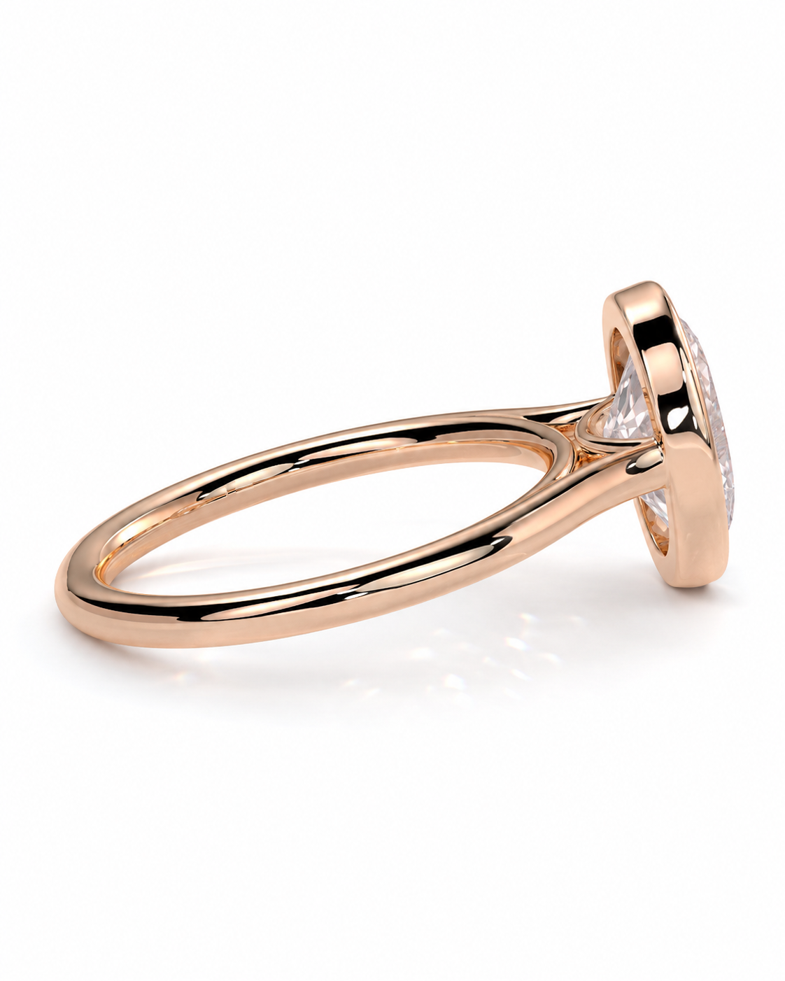 color_10K_RG, color_14K_RG &&A rose gold ring with a bezel-set clear gemstone, shown from a side angle on a clean white background.