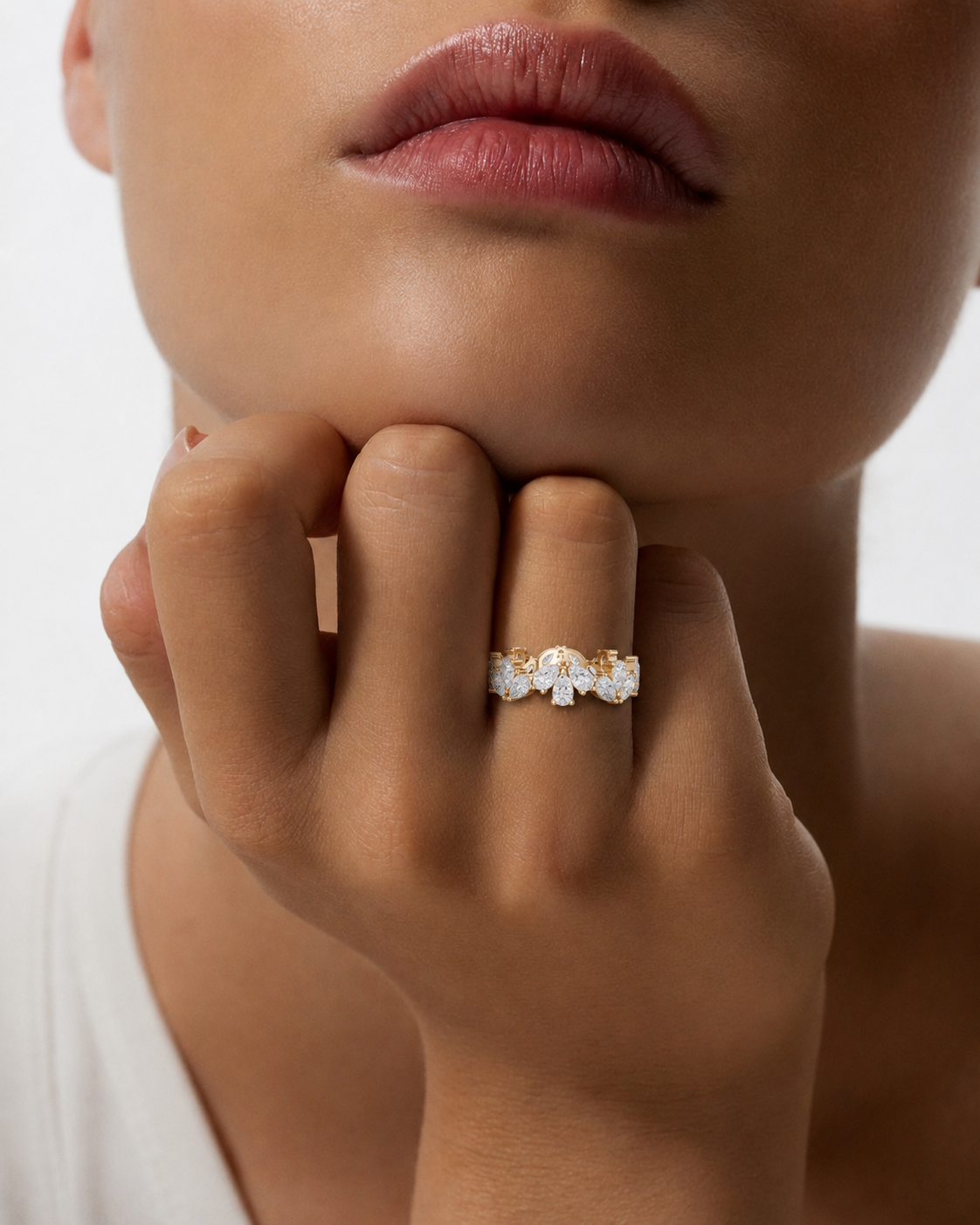color_10K_YG, color_14K_YG &&Close-up of a full eternity moissanite band with polished shared prong design.