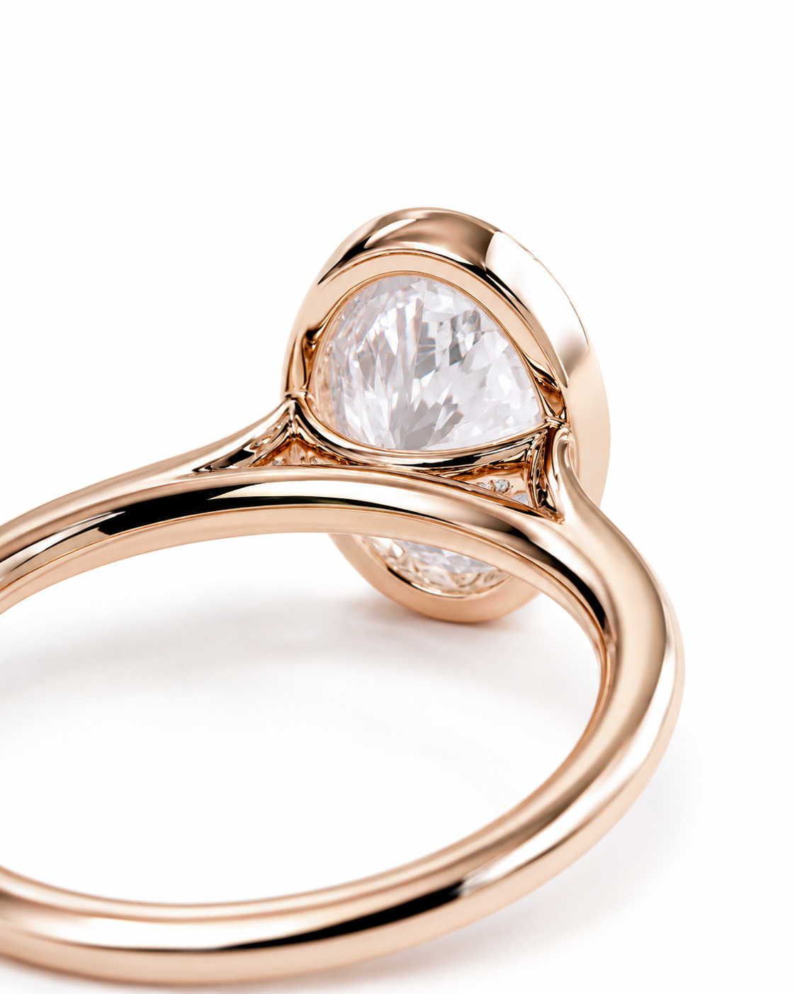 color_10K_RG, color_14K_RG &&A close-up of a rose gold ring featuring a large, teardrop-shaped clear gemstone in a prong setting, shown against a clean white background.