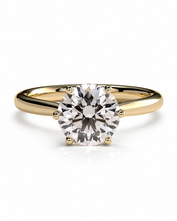 color_10K_YG, color_14K_YG &&A classic solitaire engagement ring featuring a round brilliant-cut diamond set in a yellow gold four-prong band, shown on a clean white background with a soft reflection.