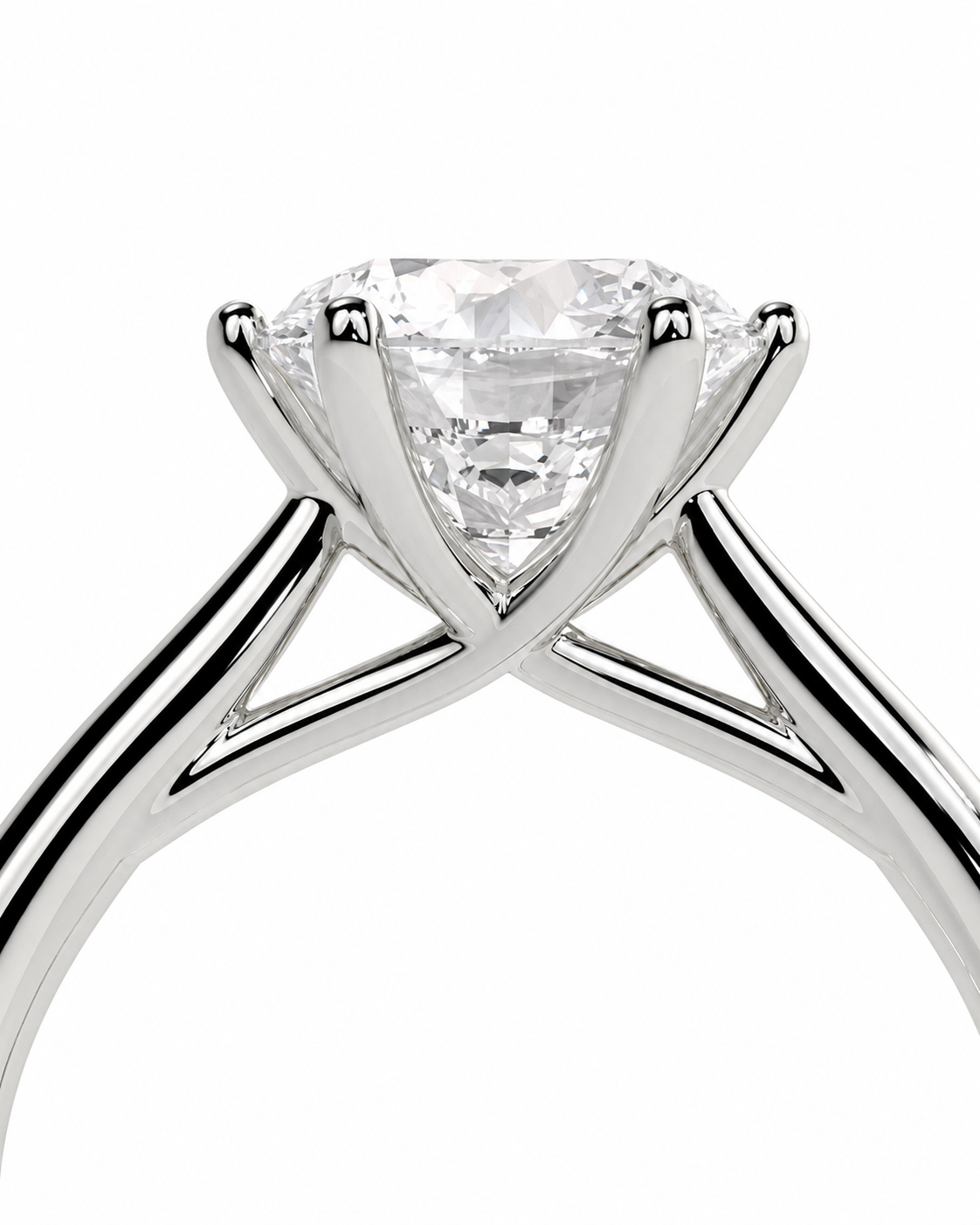 color_925_SIL,color_935_ARG,color_10K_WG, color_14K_WG &&A close-up studio shot of a solitaire engagement ring featuring a triangular-cut clear gemstone in a polished silver-colored metal setting, shown against a plain white background.