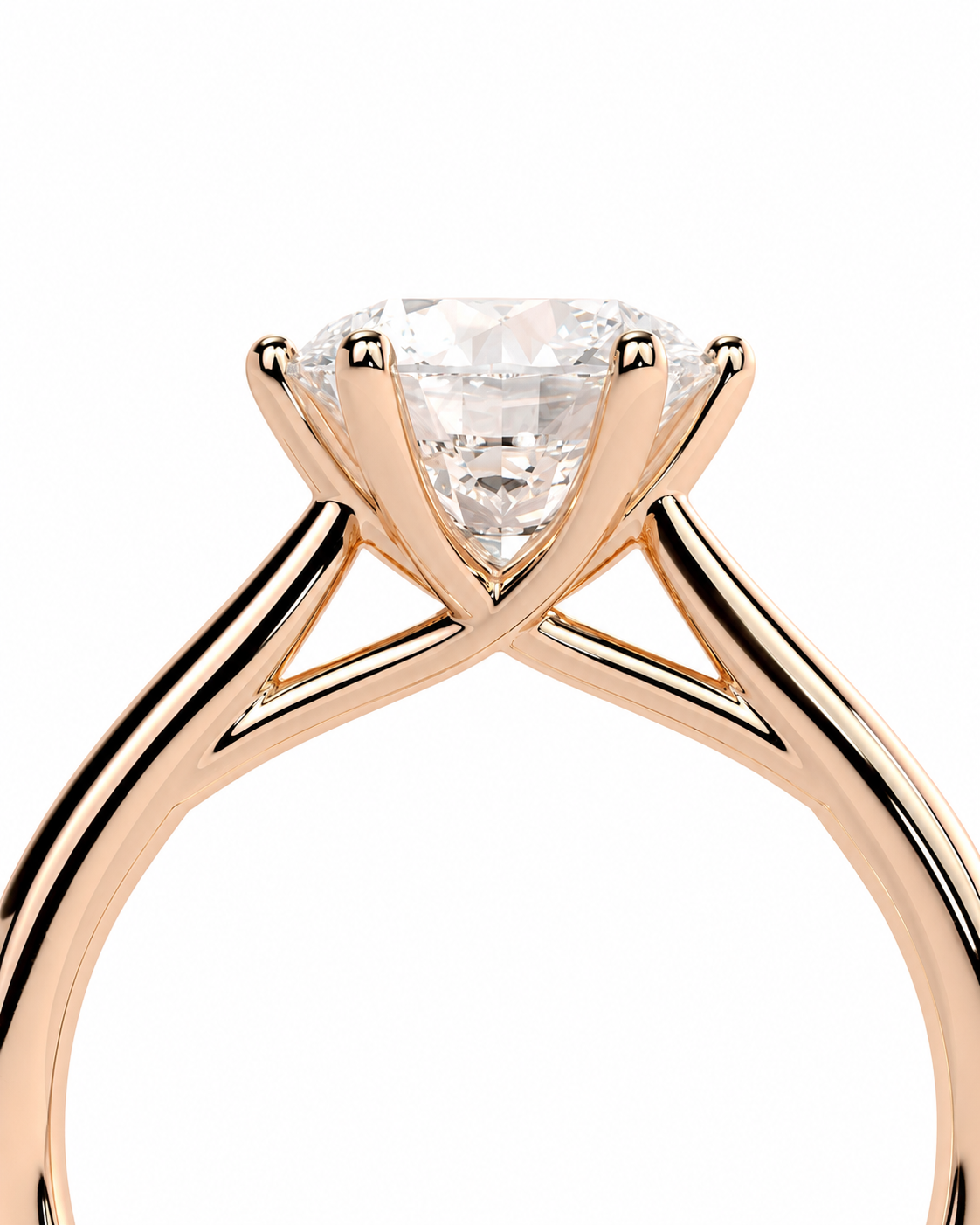 color_10K_RG, color_14K_RG &&A close-up of a rose gold solitaire engagement ring with a round brilliant-cut diamond center stone, set against a plain white background.