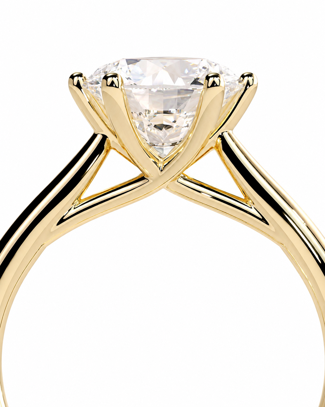 color_10K_YG, color_14K_YG &&A close-up studio shot of a yellow gold solitaire engagement ring with a clear triangular-cut diamond on a plain white background.