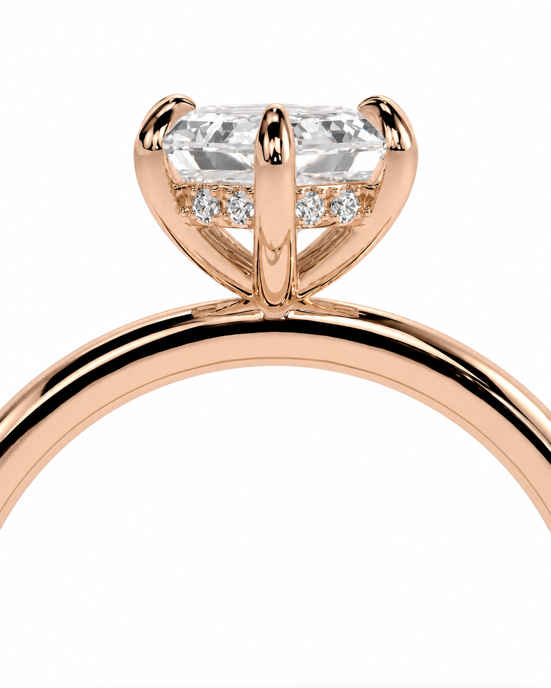 color_10K_RG, color_14K_RG &&Rose gold ring with a large rectangular clear gemstone in a four-prong setting, accented by small round stones on either side, shown on a white background.