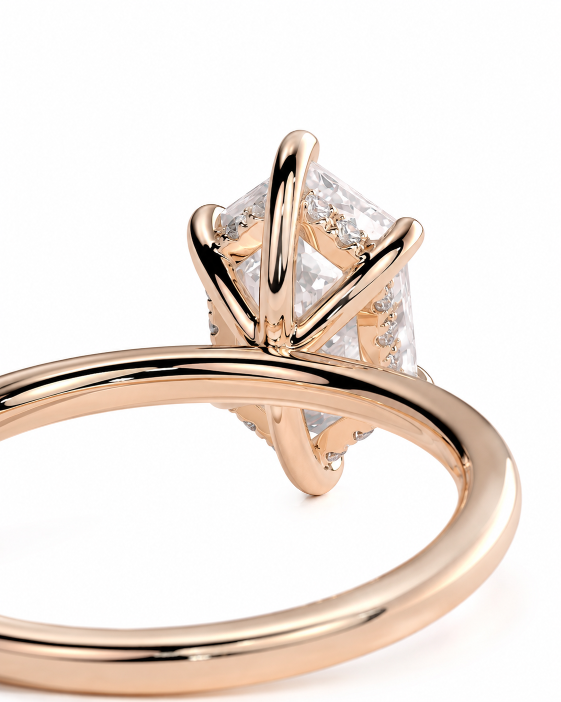 color_10K_RG, color_14K_RG &&Rose gold ring with a brilliant-cut clear gemstone in a four-prong setting, shown on a clean white background.