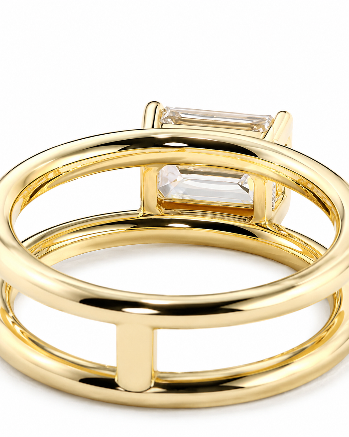 color_10K_YG, color_14K_YG &&A close-up of a gold ring with a double-band design and a clear rectangular baguette gemstone, shown on a white background.