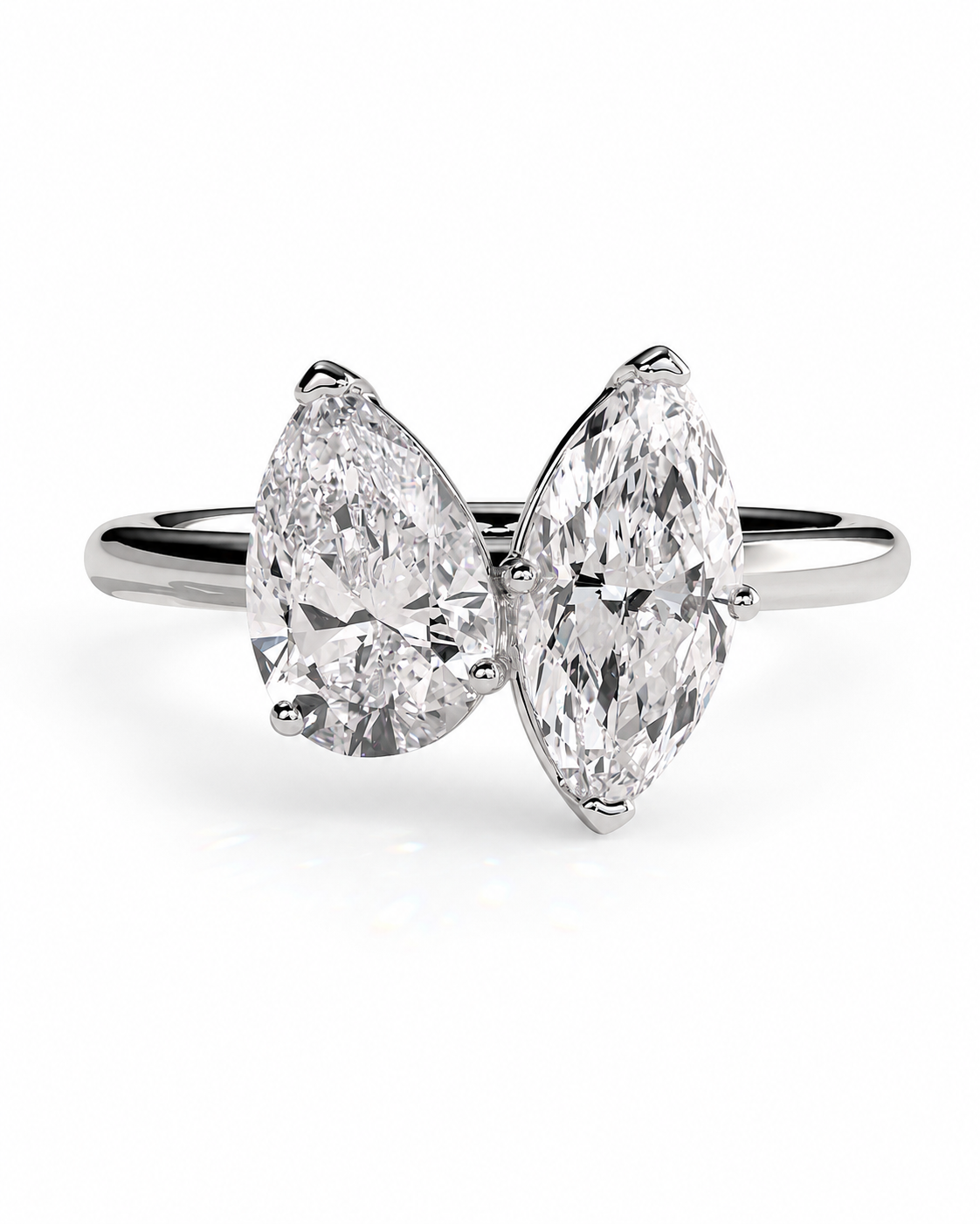 color_925_SIL,color_935_ARG,color_10K_WG, color_14K_WG &&A silver-tone double ring featuring two large pear-cut diamonds set side by side, photographed on a clean white background.