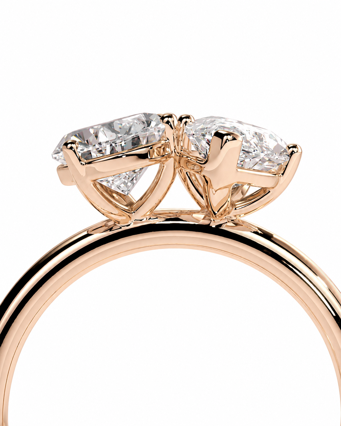 color_10K_RG, color_14K_RG &&A close-up of a rose gold ring featuring a marquise-cut diamond center stone in a prong setting, with a polished band visible below, set against a plain white background.