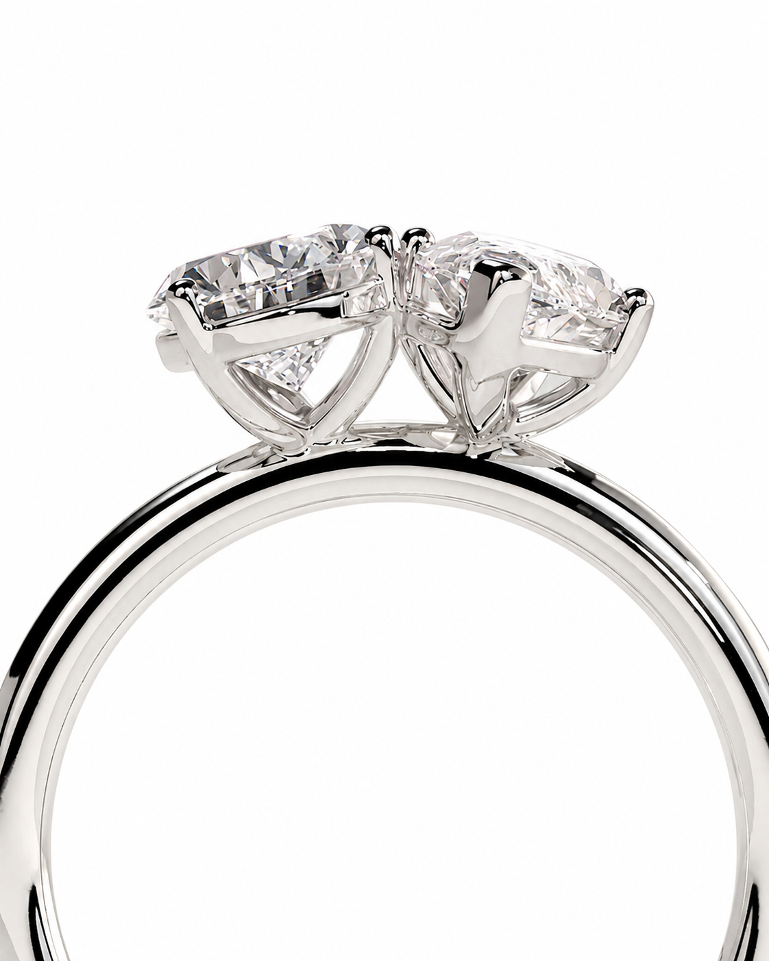 color_925_SIL,color_935_ARG,color_10K_WG, color_14K_WG &&A close-up studio shot of a silver-toned ring featuring two large clear round-cut gemstones in a prong setting, shown against a plain white background.