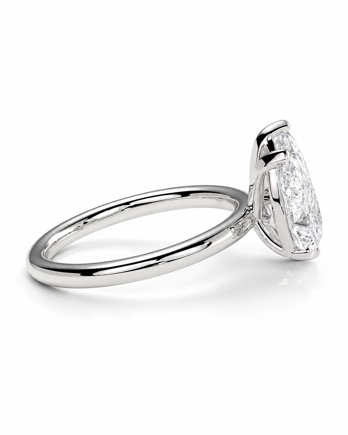 color_925_SIL,color_935_ARG,color_10K_WG, color_14K_WG &&A silver engagement ring featuring a marquise-cut diamond solitaire in a four-prong setting, shown on a clean white background.