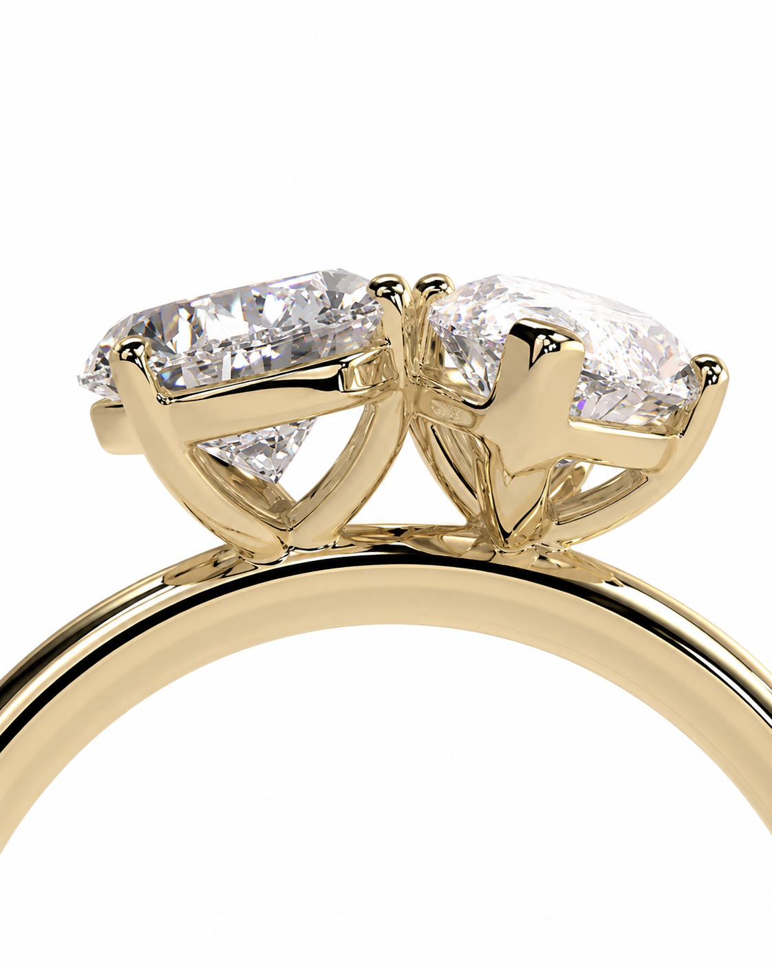 color_10K_YG, color_14K_YG &&A close-up of a yellow gold ring featuring two marquise-cut clear gemstones in a prong setting, shown against a plain white background.