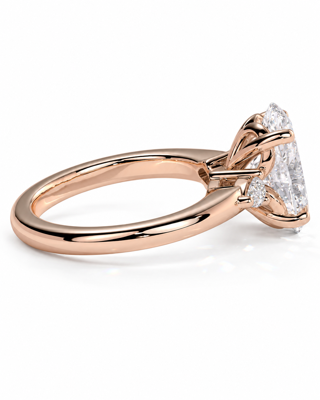 color_10K_RG, color_14K_RG &&Rose gold diamond ring with a large oval-cut center stone and smaller side stones, shown on a clean white background.