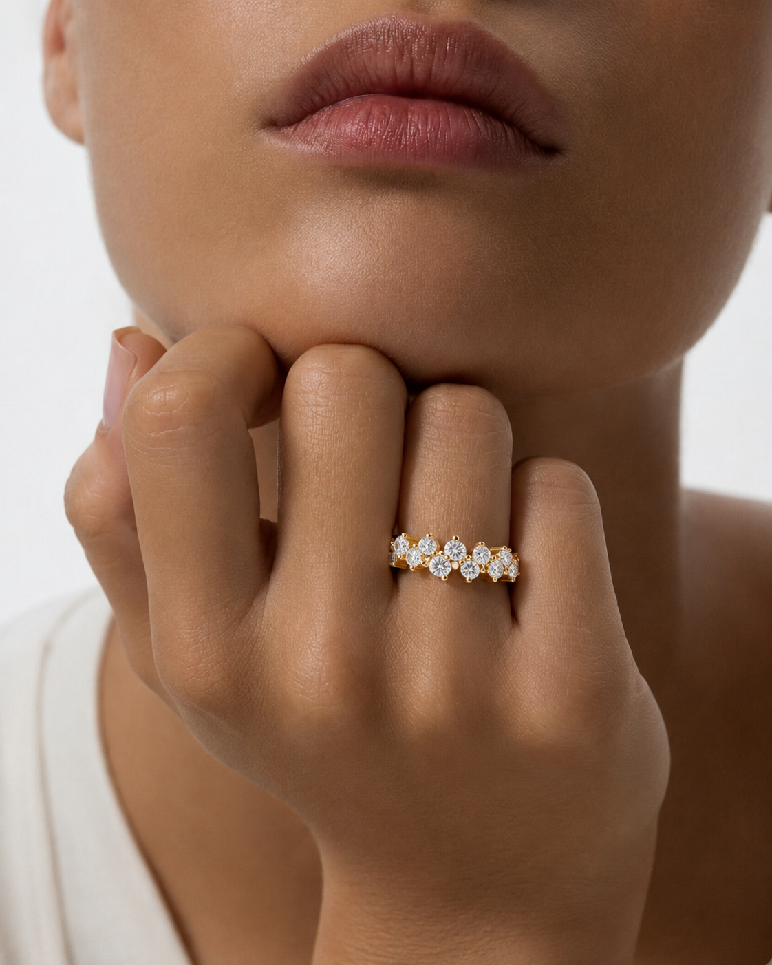color_10K_YG, color_14K_YG &&Side perspective of a handcrafted moissanite anniversary band with shared-prong style setting.