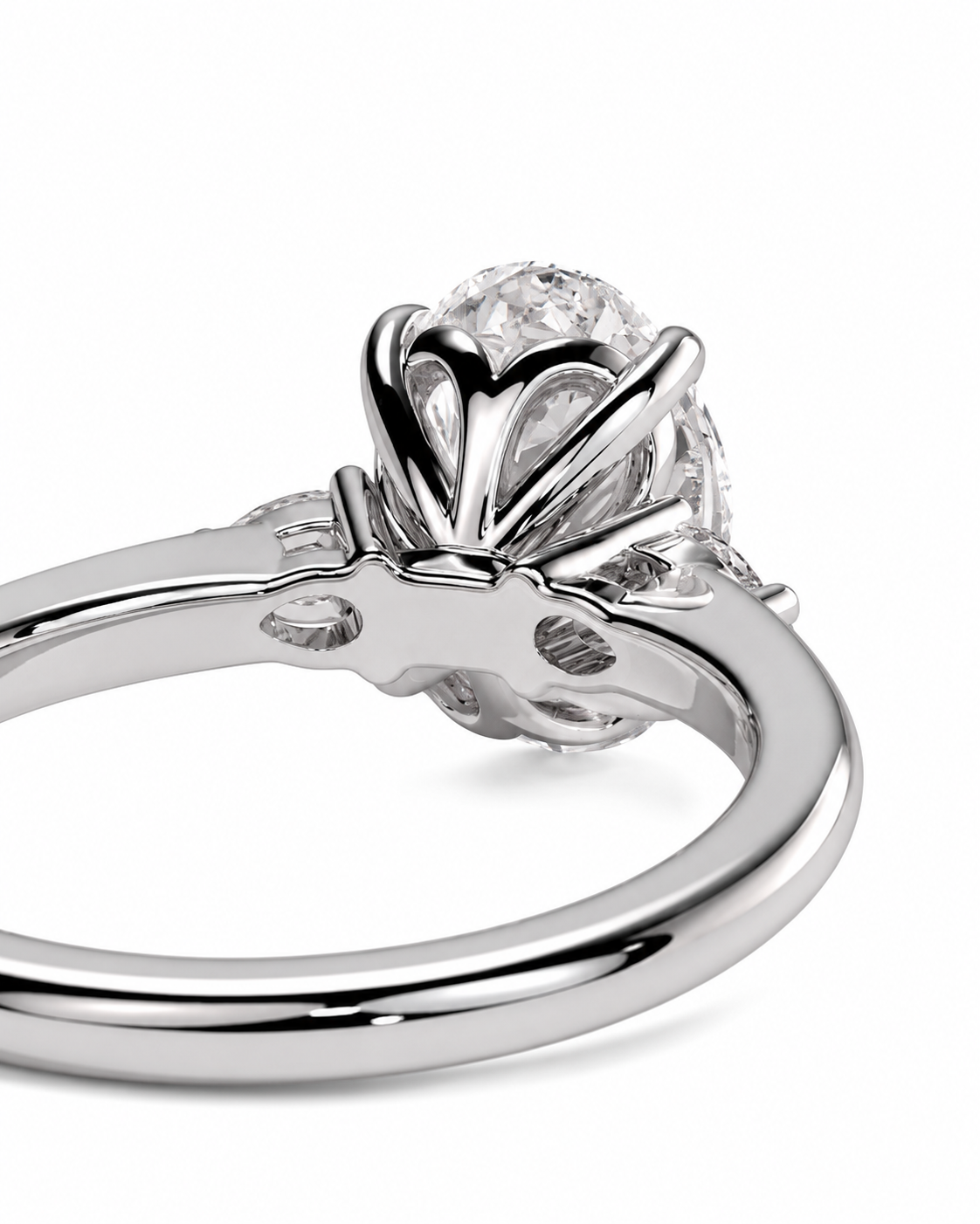 color_925_SIL,color_935_ARG,color_10K_WG, color_14K_WG &&A close-up studio shot of a silver-toned ring with a large clear round gemstone in a sculptural claw setting, shown on a white background.