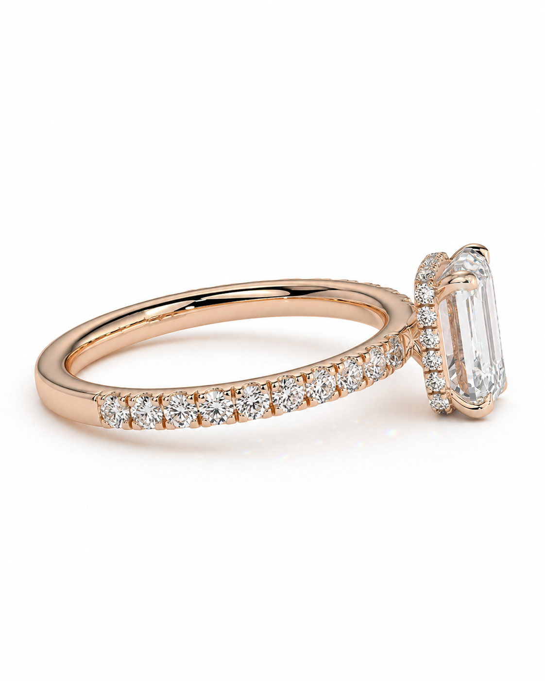 color_10K_RG, color_14K_RG &&A rose gold engagement ring featuring a large emerald-cut clear center stone in a halo setting, with a pave band of small round diamonds, shown on a clean white background.
