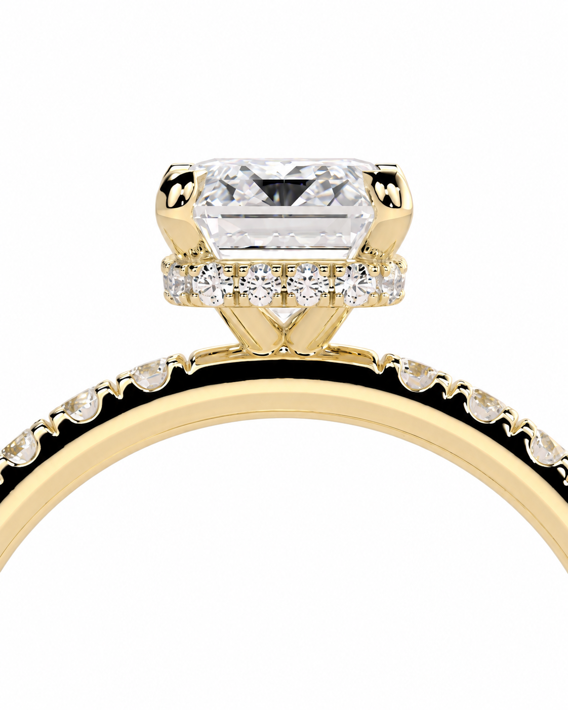 color_10K_YG, color_14K_YG &&A close-up of a yellow gold ring featuring a large rectangular clear gemstone in a prong setting, with small accent diamonds along the band and a halo around the center stone, shown on a plain white background.