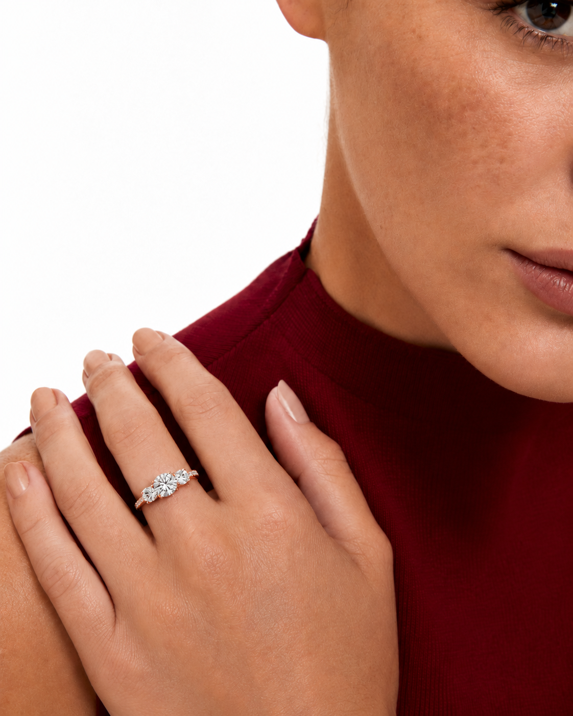 color_10K_RG, color_14K_RG &&A close-up lifestyle shot of a woman wearing a silver-toned diamond ring on her finger, with her hand resting on her shoulder against a white background.