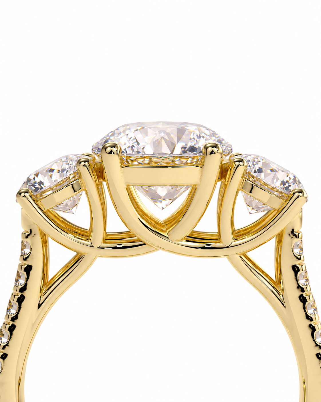 color_10K_YG, color_14K_YG &&A close-up of a yellow gold ring featuring a large oval center diamond and two smaller round diamonds on either side, set in a three-stone cluster design against a white background.