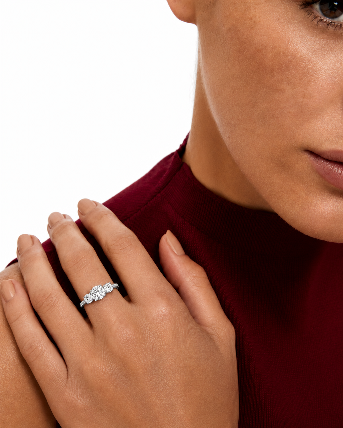 color_925_SIL,color_935_ARG,color_10K_WG, color_14K_WG &&A close-up lifestyle shot of a woman wearing a silver diamond ring on her finger, with her hand resting on her shoulder against a white background.