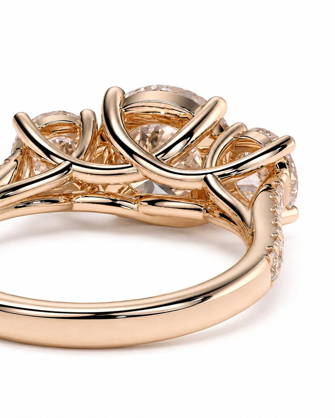 color_10K_RG, color_14K_RG &&A close-up of a rose gold ring featuring a complex, interlocking floral or vine-like setting with clear gemstones, shown on a plain white background.