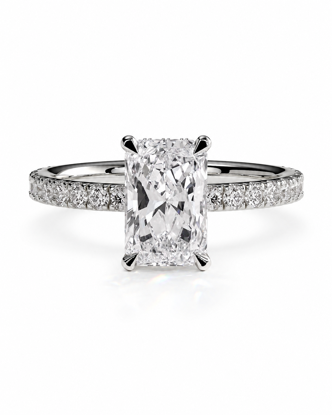 color_925_SIL,color_935_ARG,color_10K_WG, color_14K_WG &&A radiant cut diamond engagement ring with a pave-set silver band, shown on a clean white background.