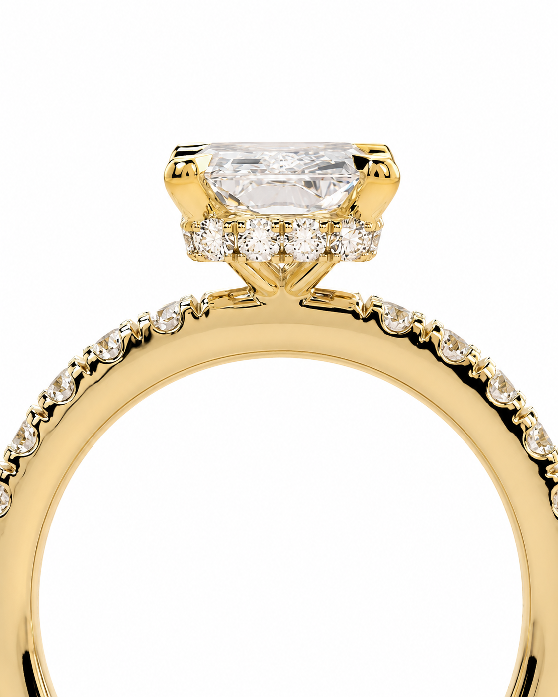 color_10K_YG, color_14K_YG &&A close-up of a yellow gold ring featuring a large rectangular clear gemstone in a prong setting, with smaller round stones along the band, shown on a white background.