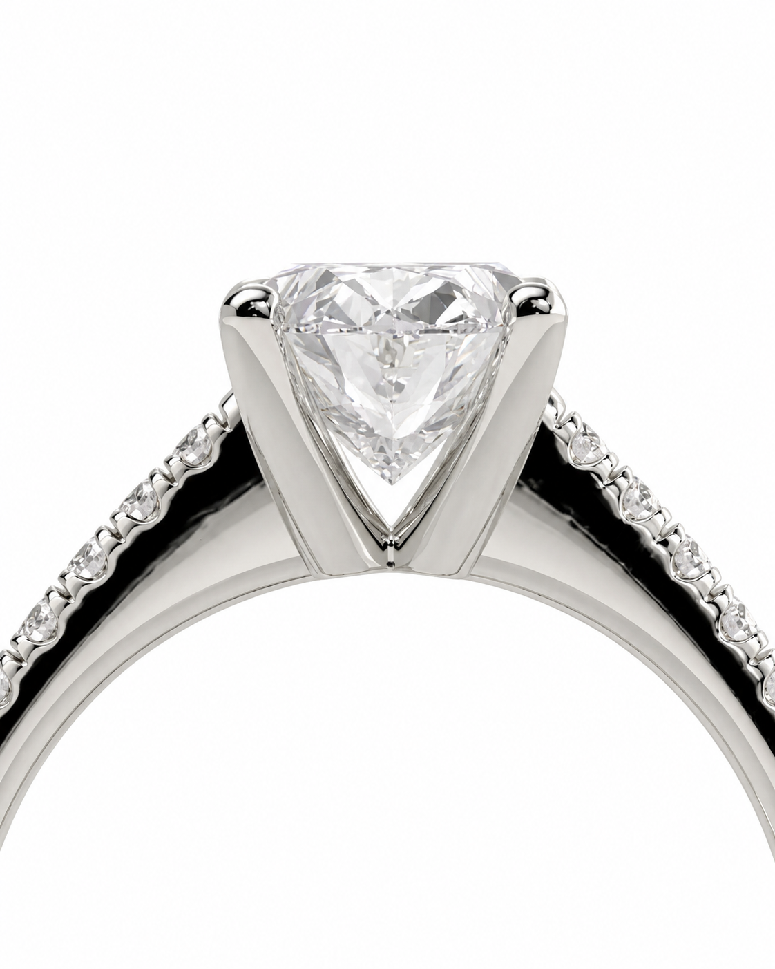 color_925_SIL,color_935_ARG,color_10K_WG, color_14K_WG &&A close-up studio shot of a silver-toned ring featuring a large heart-shaped clear gemstone in a prong setting, with a pave band on each side.