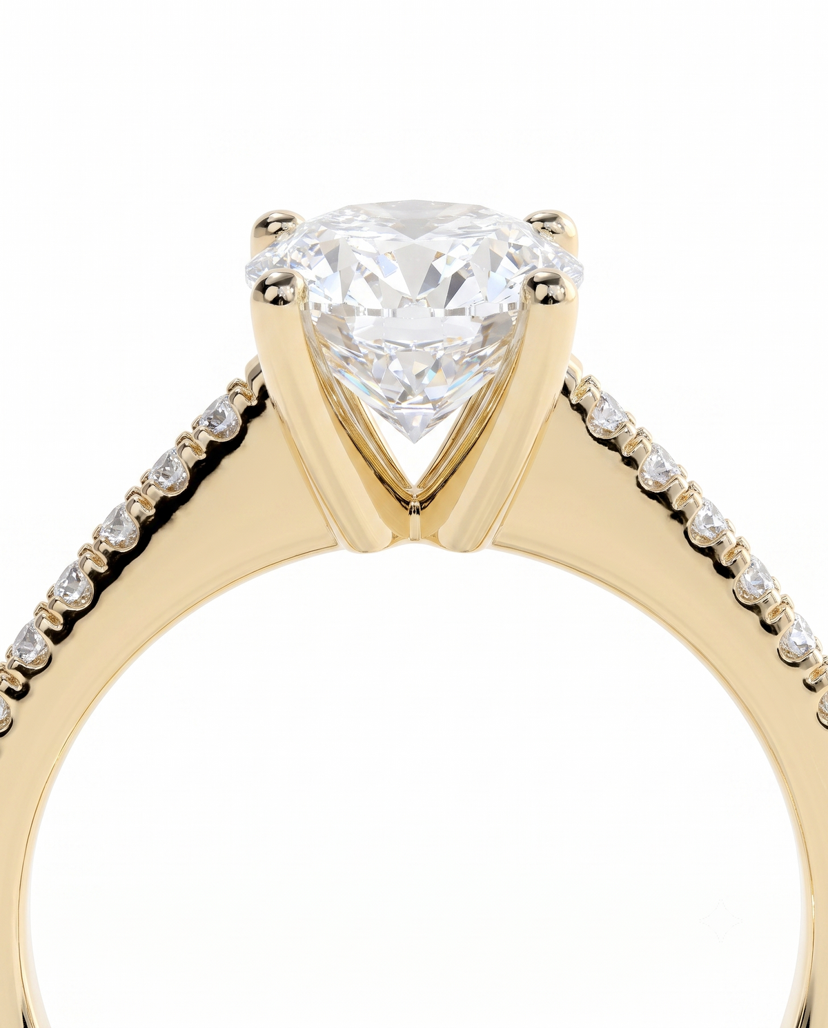 color_10K_YG, color_14K_YG &&A close-up of a yellow gold diamond ring featuring a large pear-cut center stone in a four-prong setting, with small pave diamonds along the shoulders, shown against a solid white background.