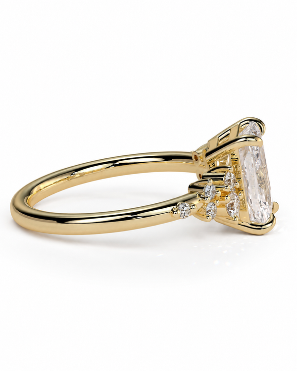 color_10K_YG, color_14K_YG &&A yellow gold ring featuring a large rectangular clear gemstone in a prong setting, with smaller accent stones along the band, shown on a clean white background.