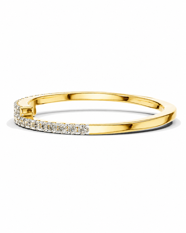 color_10K_YG, color_14K_YG &&A yellow gold huggie bangle ring featuring a row of clear pavé-set round diamonds along the front half of the band, shown on a clean white background.