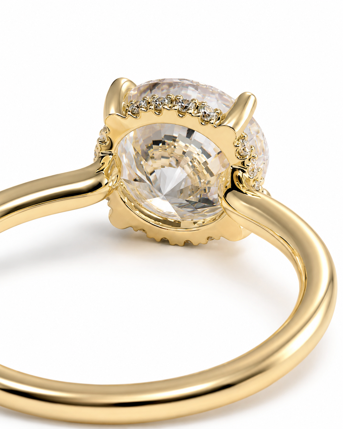 color_10K_YG, color_14K_YG &&A close-up shot of a gold ring featuring a large oval clear gemstone in a prong setting, accented by small pavé diamonds along the top, on a white background.