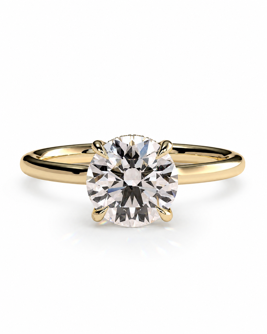 color_10K_YG, color_14K_YG &&A classic solitaire engagement ring featuring a round brilliant-cut diamond set in a yellow gold four-prong band, shown on a clean white background.