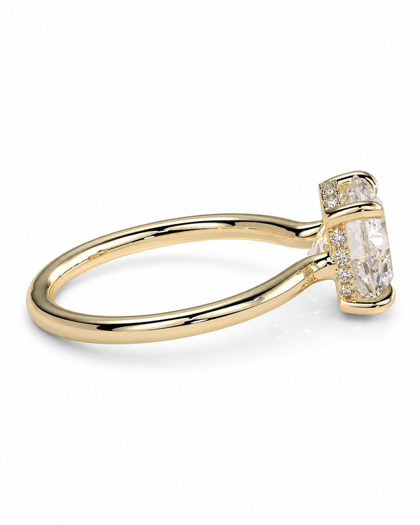color_10K_YG, color_14K_YG &&A yellow gold ring featuring a large rectangular clear gemstone in a prong setting, accented by small round diamonds along the band, shown on a clean white background.