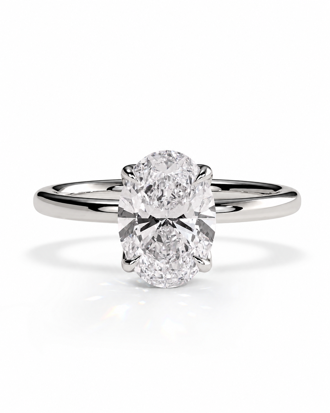 color_925_SIL,color_935_ARG,color_10K_WG, color_14K_WG &&A classic solitaire engagement ring featuring a round brilliant-cut diamond set in a polished white gold or platinum band, shown on a clean white background with a soft reflection.